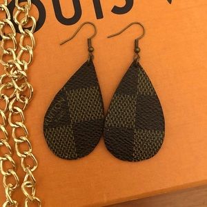 Authentic Louis Vuitton canvas earrings.